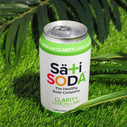 Sati Soda can on grass with green leaves